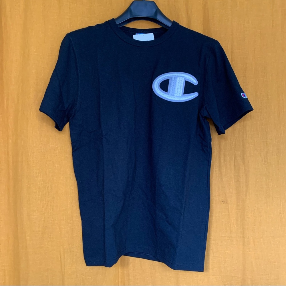 Black, large embroidered logo Champion t-shirt. New with tags.